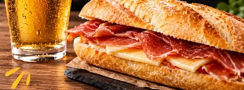 Caña de cerveza y montado de jamón